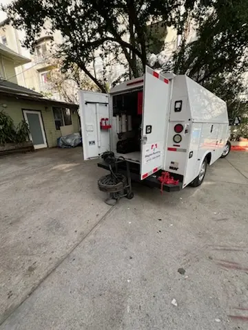 Magnet Plumbing service vehicle on-site for Grease Trap Cleaning in Waggaman Heights